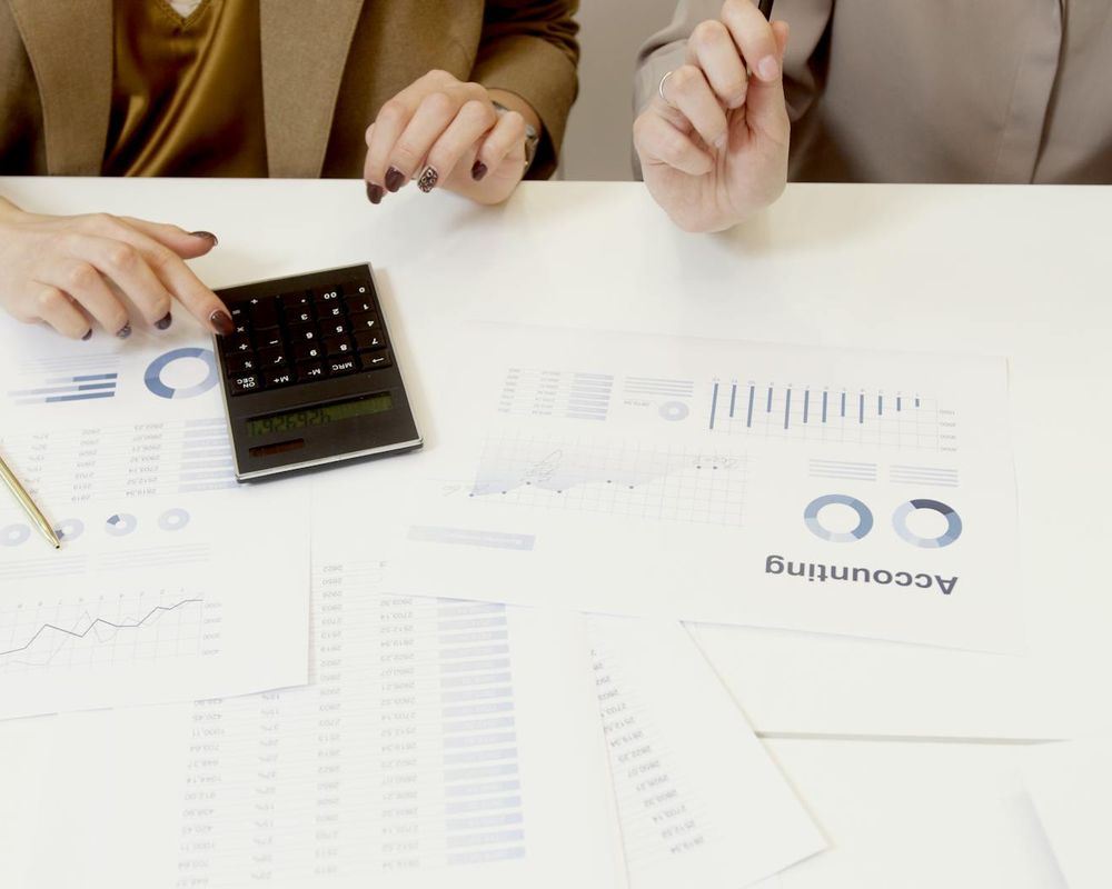 Internal quality management audit team reviewing compliance procedures